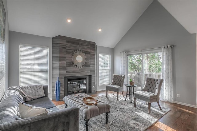 4016 W 79th St, Prairie Village, KS 66208 - living room with high vaulted ceiling, a large fireplace, recessed lighting, baseboards, and wood finished floors