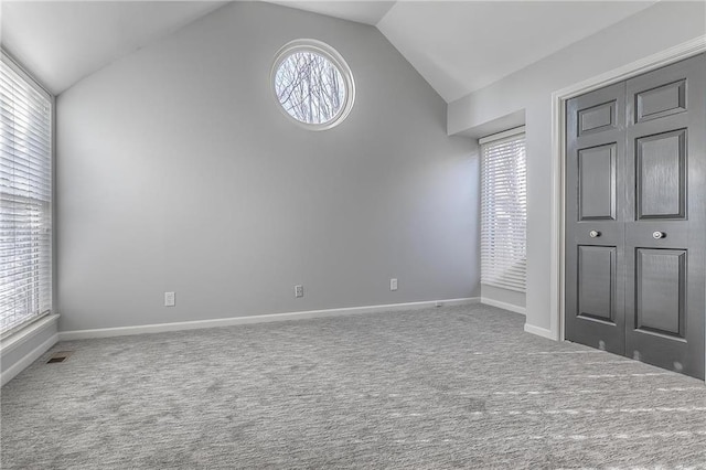 4016 W 79th St, Prairie Village, KS 66208 - unfurnished bedroom with carpet, vaulted ceiling, and multiple windows