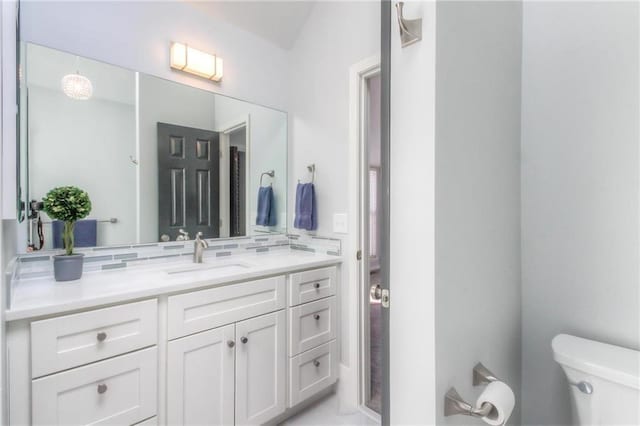 4016 W 79th St, Prairie Village, KS 66208 - bathroom with backsplash, toilet, and vanity