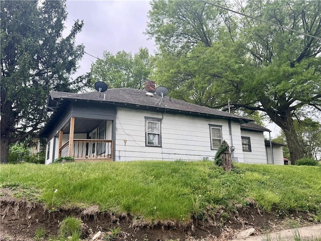 view of side of property with a chimney