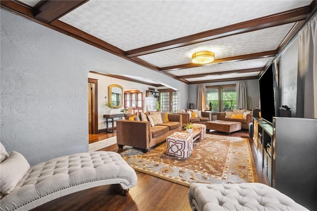 3804 Harrison St, Kansas City, MO 64109 - living room with a textured wall, wood finished floors, and beamed ceiling