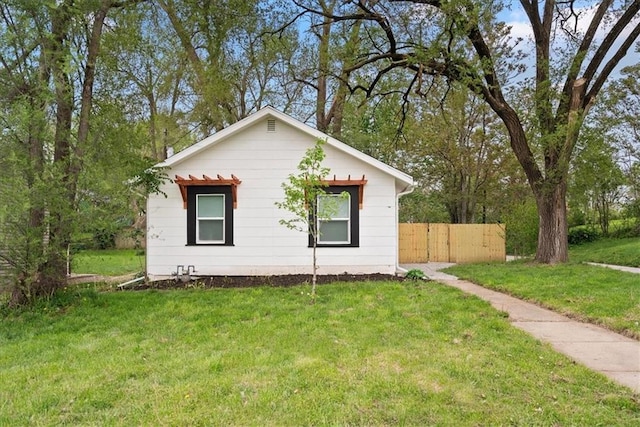 15015 E Truman Rd, Independence, MO 64050 - view of side of home with a lawn and fence
