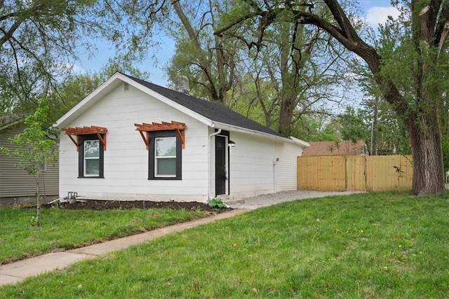 15015 E Truman Rd, Independence, MO 64050 - exterior space featuring fence and a front lawn