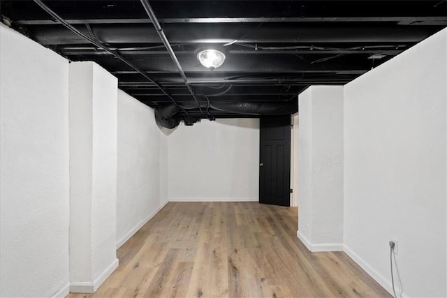 15015 E Truman Rd, Independence, MO 64050 - finished below grade area with baseboards and wood finished floors