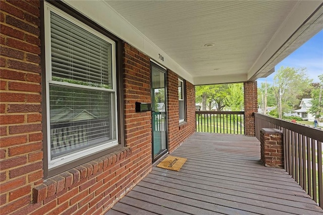 708 N River Blvd, Independence, MO 64050 - deck featuring a porch