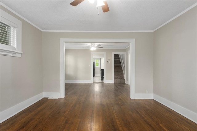 708 N River Blvd, Independence, MO 64050 - unfurnished room with a ceiling fan, baseboards, wood finished floors, and stairway