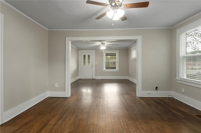 708 N River Blvd, Independence, MO 64050 - empty room featuring crown molding, dark wood-style flooring, baseboards, a textured ceiling, and a ceiling fan
