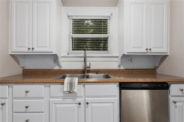 708 N River Blvd, Independence, MO 64050 - kitchen featuring a sink, dark countertops, white cabinets, and dishwasher