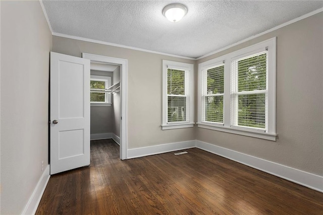 708 N River Blvd, Independence, MO 64050 - unfurnished room with baseboards, ornamental molding, dark wood finished floors, and a textured ceiling