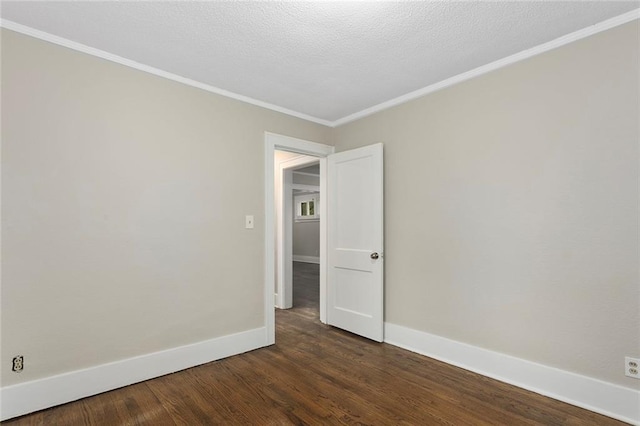 708 N River Blvd, Independence, MO 64050 - unfurnished room with baseboards, ornamental molding, a textured ceiling, and dark wood-type flooring