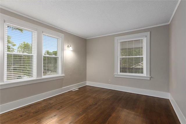 708 N River Blvd, Independence, MO 64050 - empty room with baseboards, a textured ceiling, dark wood-style floors, and ornamental molding