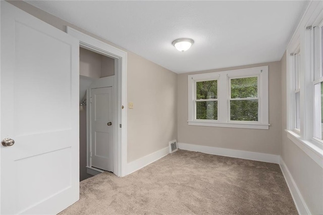 708 N River Blvd, Independence, MO 64050 - empty room with carpet floors, baseboards, and visible vents