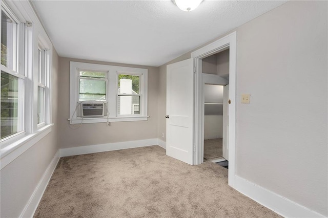 708 N River Blvd, Independence, MO 64050 - unfurnished bedroom featuring baseboards, carpet, cooling unit, and vaulted ceiling