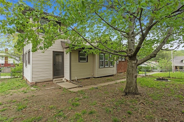 708 N River Blvd, Independence, MO 64050 - back of house with fence and entry steps