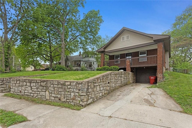 708 N River Blvd, Independence, MO 64050 - view of front of property with an attached garage, brick siding, driveway, and a front yard