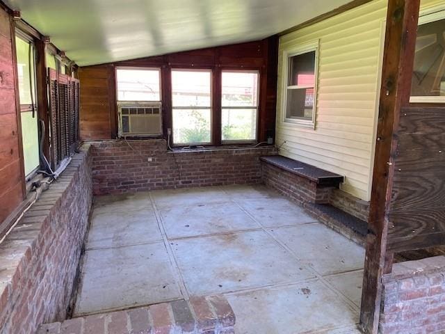 unfurnished sunroom featuring cooling unit