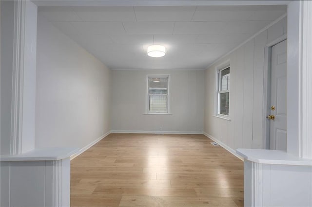 4433 N Jackson Ave, Kansas City, MO 64117 - empty room with baseboards and light wood-style flooring