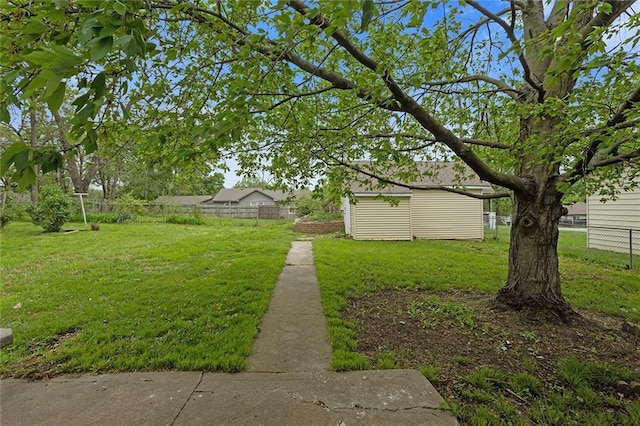 4433 N Jackson Ave, Kansas City, MO 64117 - view of yard featuring fence and an outbuilding