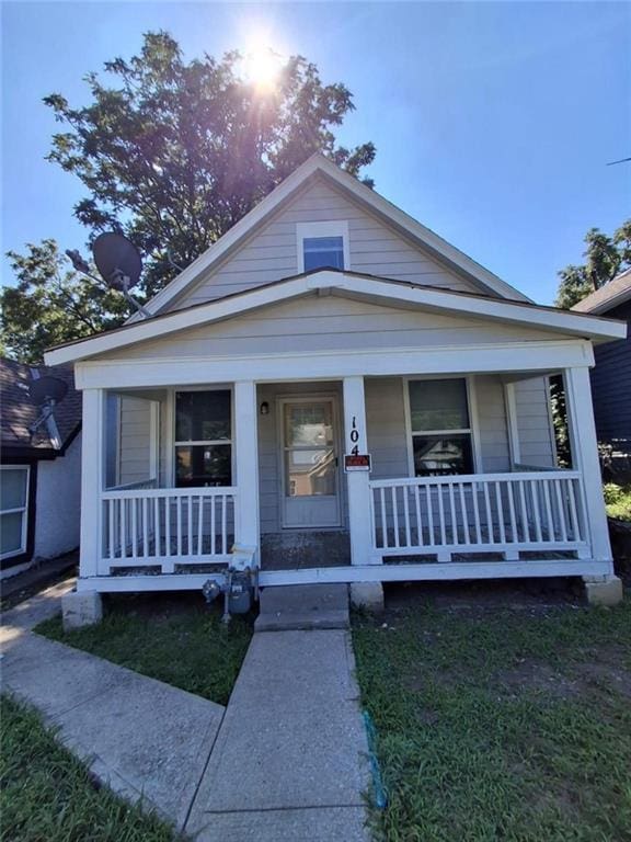 104 S 13th St, Kansas City, KS 66102 - view of front facade featuring a porch