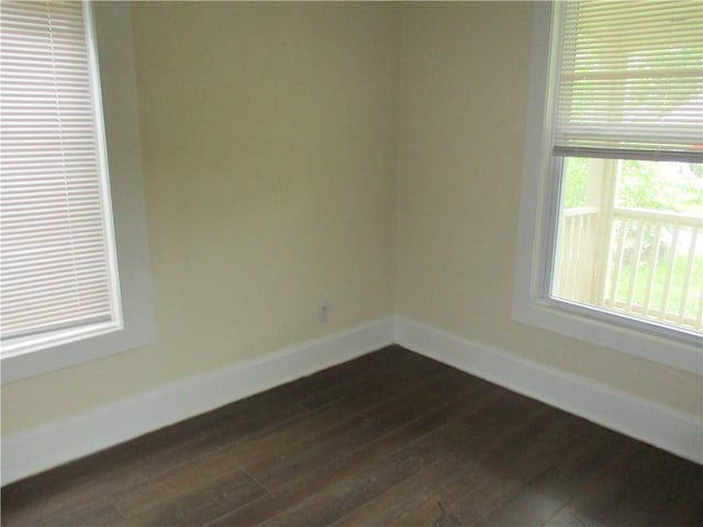 104 S 13th St, Kansas City, KS 66102 - spare room with dark wood finished floors and baseboards