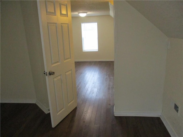 104 S 13th St, Kansas City, KS 66102 - bonus room with dark wood-type flooring and baseboards