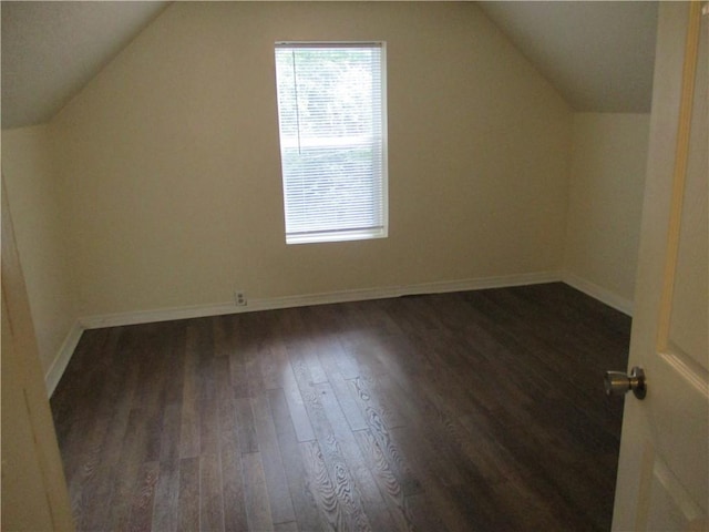 104 S 13th St, Kansas City, KS 66102 - additional living space featuring dark wood-style floors and lofted ceiling