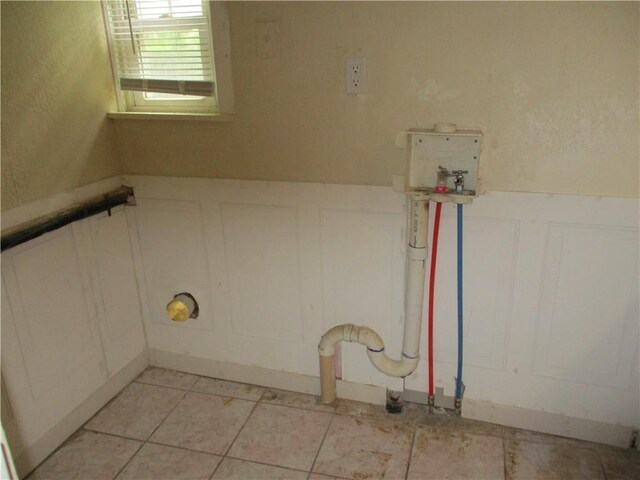 104 S 13th St, Kansas City, KS 66102 - washroom with a decorative wall, wainscoting, and washer hookup