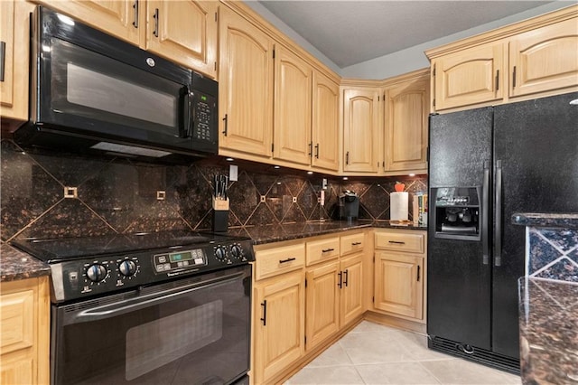 kitchen featuring light tile patterned flooring, decorative backsplash, black appliances, and light brown cabinets