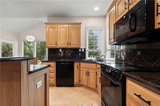 kitchen with backsplash, light brown cabinetry, a sink, light tile patterned floors, and black appliances