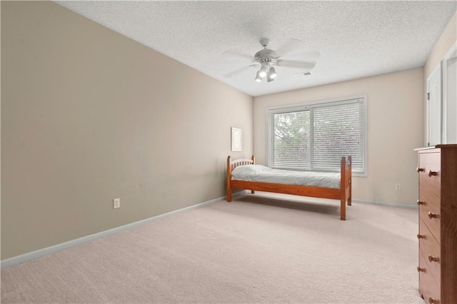 bedroom featuring baseboards, visible vents, and carpet