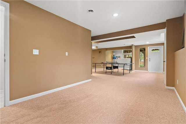 empty room featuring carpet floors, recessed lighting, baseboards, and visible vents