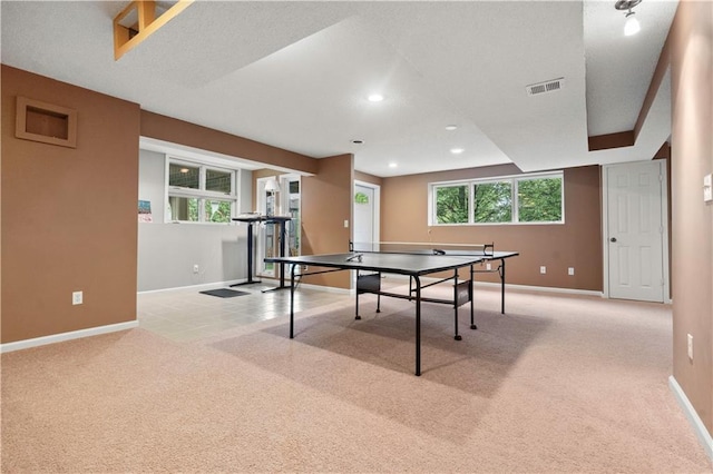 recreation room with carpet floors, baseboards, and a healthy amount of sunlight