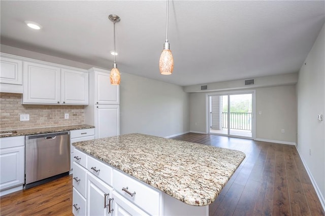 kitchen featuring white cabinets, dishwasher, baseboards, decorative backsplash, and visible vents