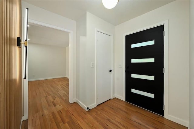 3907 Scherer Rd, Lees Summit, MO 64082 - entrance foyer featuring baseboards and wood finished floors