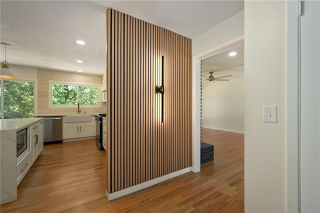 3907 Scherer Rd, Lees Summit, MO 64082 - hall featuring a sink, recessed lighting, and light wood-type flooring