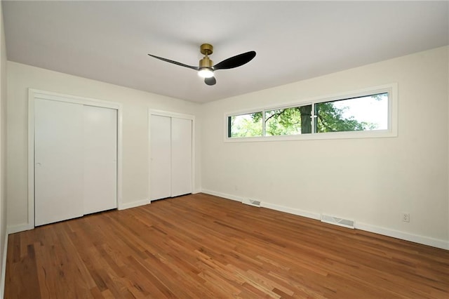 3907 Scherer Rd, Lees Summit, MO 64082 - unfurnished bedroom featuring visible vents, multiple closets, and baseboards