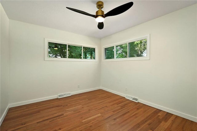 3907 Scherer Rd, Lees Summit, MO 64082 - unfurnished room with ceiling fan, baseboards, visible vents, and wood finished floors