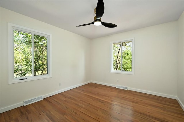 3907 Scherer Rd, Lees Summit, MO 64082 - spare room with a ceiling fan, baseboards, visible vents, and wood finished floors