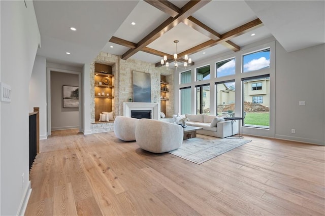 living room featuring a fireplace, baseboards, recessed lighting, coffered ceiling, and light wood finished floors