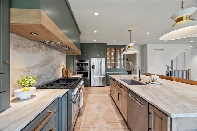 kitchen featuring visible vents, glass insert cabinets, recessed lighting, a sink, and stainless steel appliances