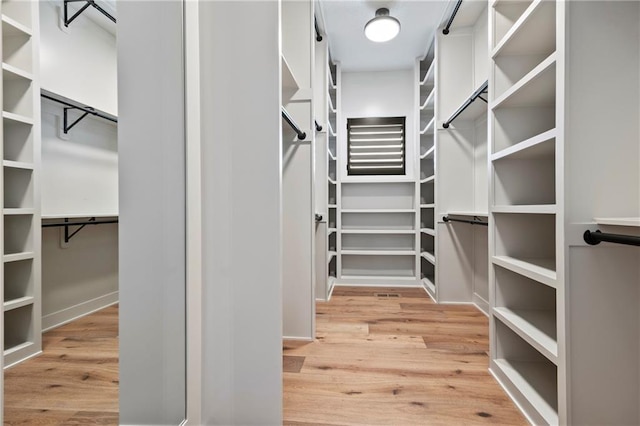 spacious closet with wood finished floors