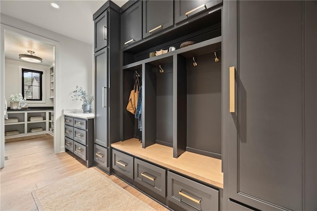 mudroom with recessed lighting and light wood-style floors