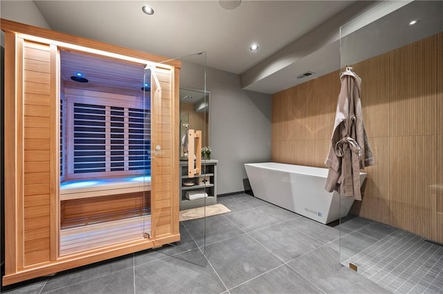 full bath with a freestanding bath, tile patterned flooring, recessed lighting, and visible vents