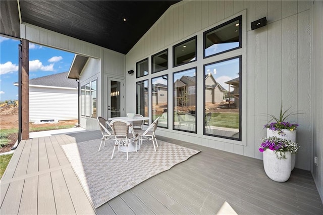 wooden terrace featuring outdoor dining space