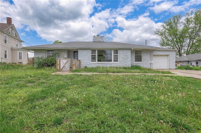single story home featuring a front lawn, stone siding, a garage, a chimney, and driveway