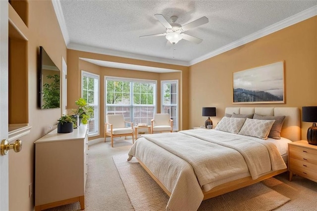bedroom featuring crown molding, a ceiling fan, a textured ceiling, and light colored carpet