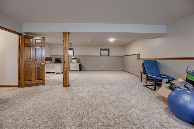rec room featuring baseboards and carpet