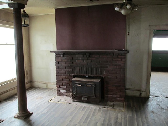 820 Custer St, Trenton, MO 64683 - interior details with a wood stove, wood finished floors, and visible vents