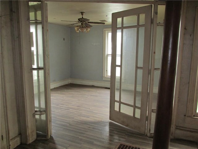 820 Custer St, Trenton, MO 64683 - spare room with baseboards, a ceiling fan, and wood finished floors