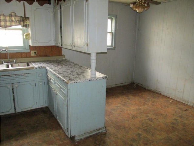 820 Custer St, Trenton, MO 64683 - kitchen with a sink, light countertops, ceiling fan, and a healthy amount of sunlight